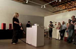 2026 FUSE resident Elan Retzlaff discusses their project during the Maker-in-Residence opening.